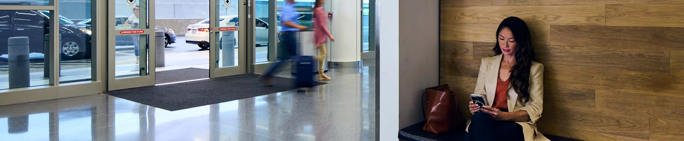 Woman seated in blue express curbside