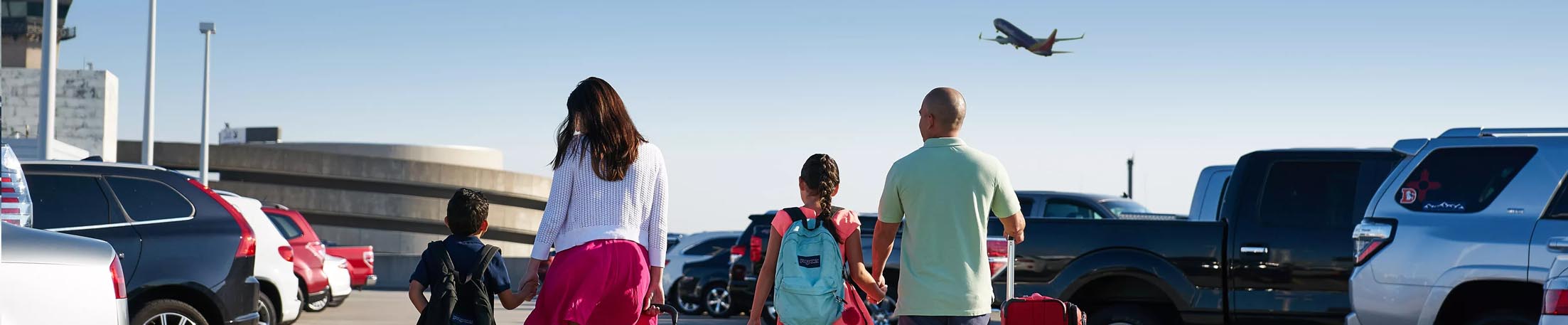 Family walking in parking lot