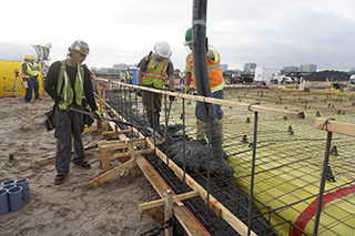 Concrete being poured at first Rental Car Service Center