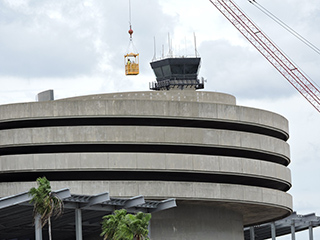 Construction crew flying in a cage over Helix