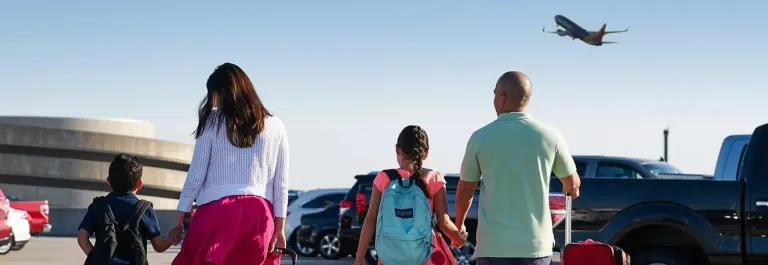 Family walking in parking lot