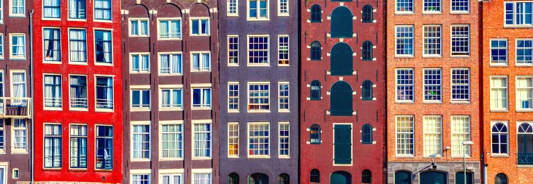 houses along canal in amsterdam