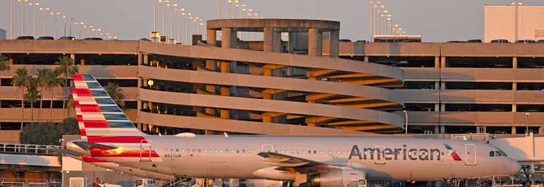 Parking garage with American plane in front of it