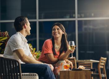 Man and woman sitting outdoors at tpa