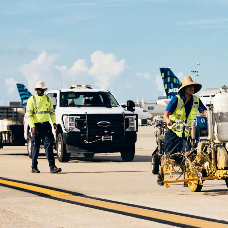 TPA employees working on airfield